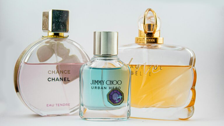 Elegant display of designer perfume bottles featuring Chanel, Jimmy Choo, and Estee Lauder.
